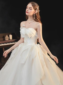 חתונה לבנה השמלות כתף נסיכת אונליין רכבת משפט ללא שרוולים תחרה, אפליקציות חרוזים Bowknot 2023 חדש שמלות כלה