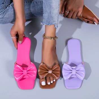 נשים קיץ חדשות הקשת קשר נעלי אופנה שטוח גודל גדול ממתקים בצבעים סנדלים נקבה סקסי מקרית חיצונית חוף נעלי בית